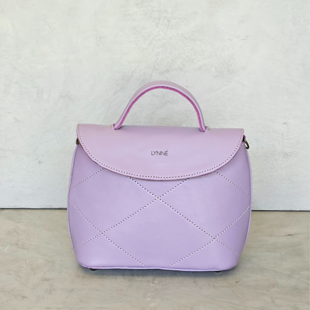 genuine leather handbag with detailed stitching and purple colour-coco-lynné