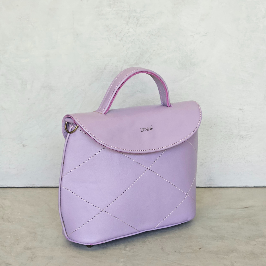 genuine leather handbag with detailed stitching and purple colour-coco-lynné