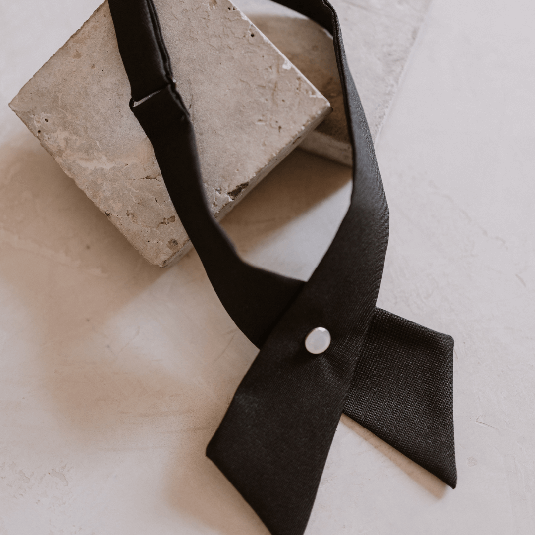 neck collar accessory a black cross over with a pearl detail button and adjustable-collar accessory-lynne