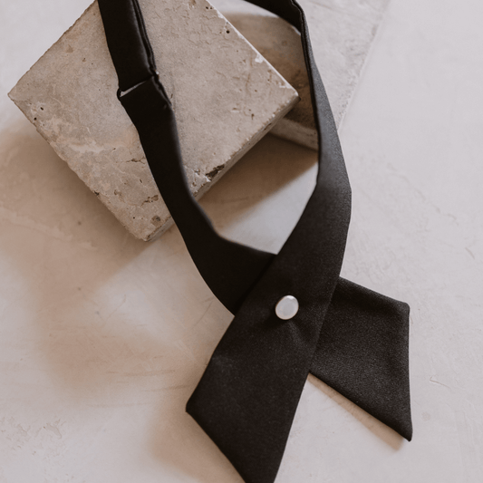 neck collar accessory a black cross over with a pearl detail button and adjustable-collar accessory-lynne