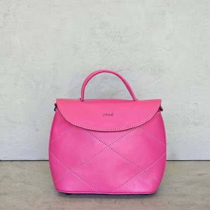 genuine leather handbag with detailed stitching and hot pink colour-coco-lynne