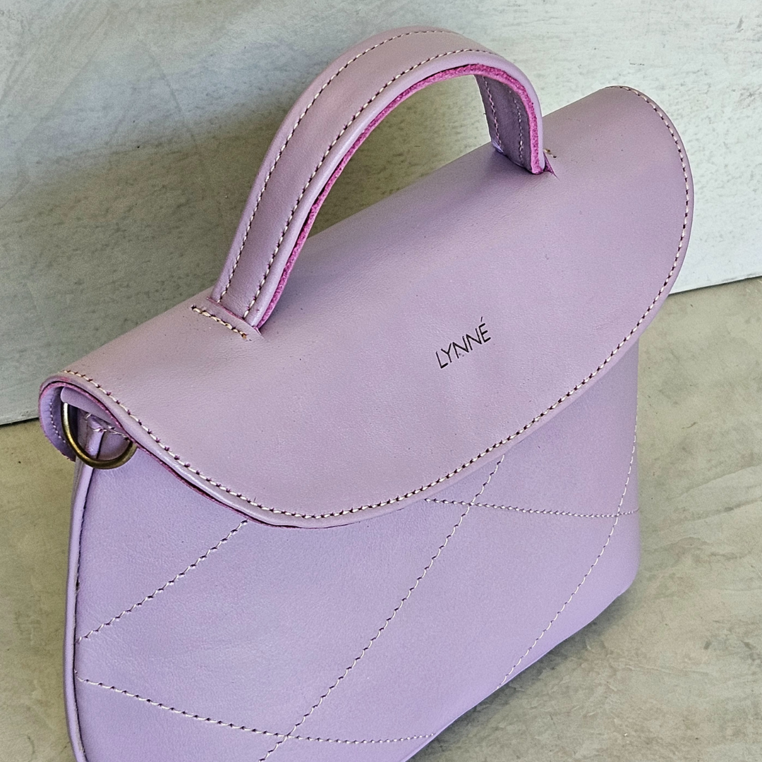 genuine leather handbag with detailed stitching and purple colour-coco-lynné