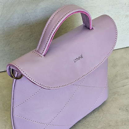 genuine leather handbag with detailed stitching and purple colour-coco-lynné