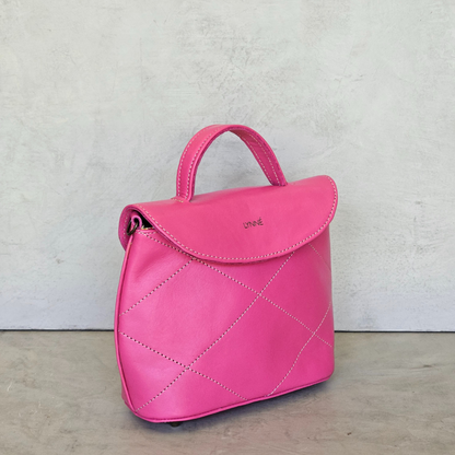 genuine leather handbag with detailed stitching and hot pink colour-coco-lynne