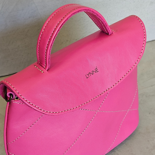 genuine leather handbag with detailed stitching and hot pink colour-coco-lynne