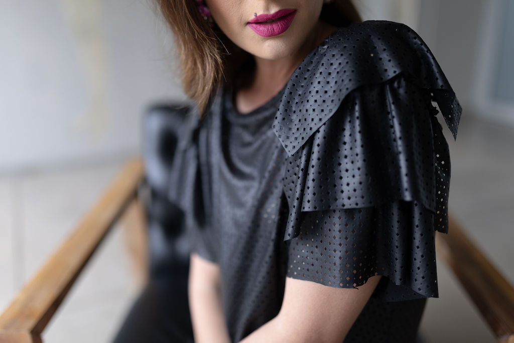 Black pleather dress with detail sleeves loose fit and comfortable